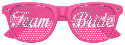 Pink TEAM BRIDE wedding party sunglasses by Funglasses with "TEAM BRIDE" lettering, ideal for bridal celebrations and photos.